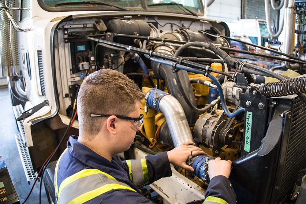 Students working on truck engine