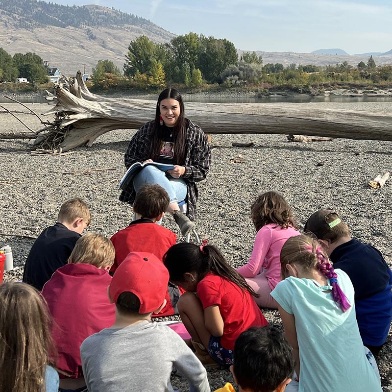 teacher with children at beach